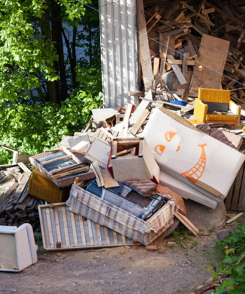 A pile of junk sitting next to a building